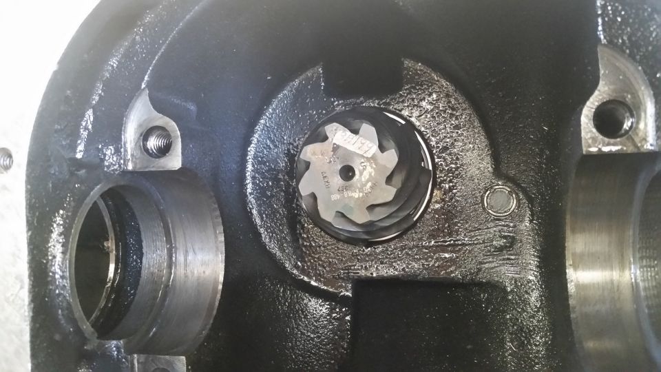 Close-up of differential gear with visible part numbers