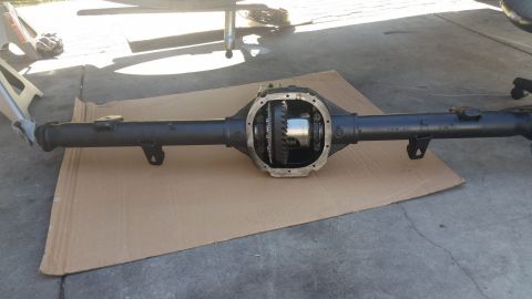 1992 Ford Bronco - Rear axle assembly removed from a vehicle, showing internal gears.