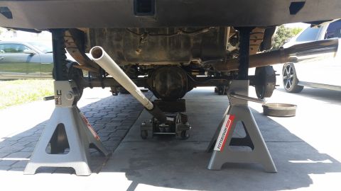 1992 Ford Bronco - The rear axle of a 1992 Ford Bronco is raised on jack stands for maintenance.