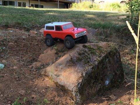 1989 Ford Bronco - A remote control car resembling a classic SUV navigates an outdoor obstacle course.