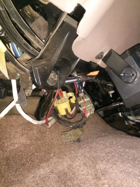 1996 Ford Bronco - Close-up view of a vehicle's interior wiring harness and connectors.