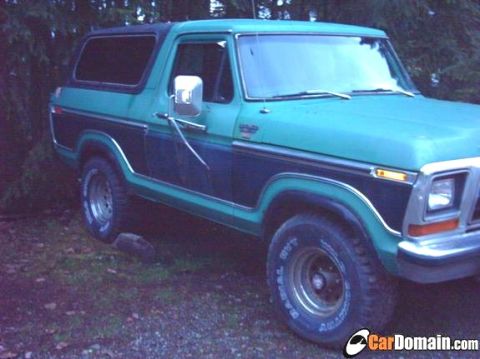 1978 Ford Bronco - This two-tone green and dark blue Ford Bronco appears to be a 1978 model, viewed from the front three-quarter angle.