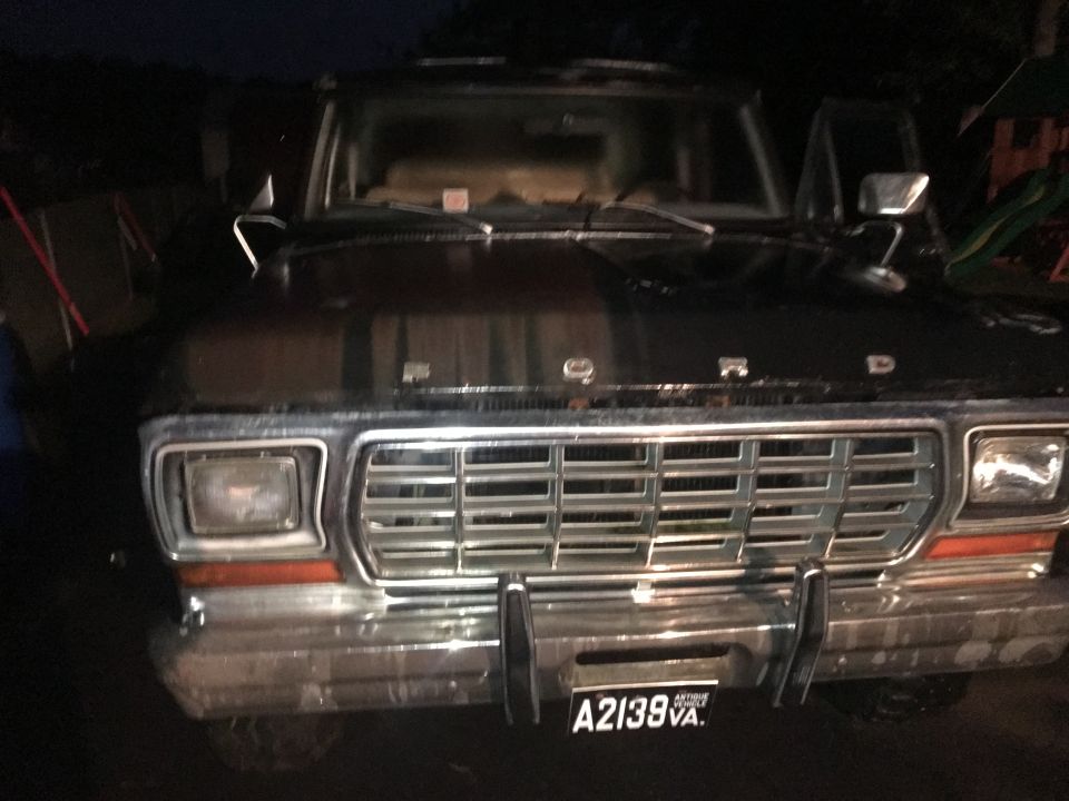 Black 1979 Ford Bronco front view with chrome grille and license plate