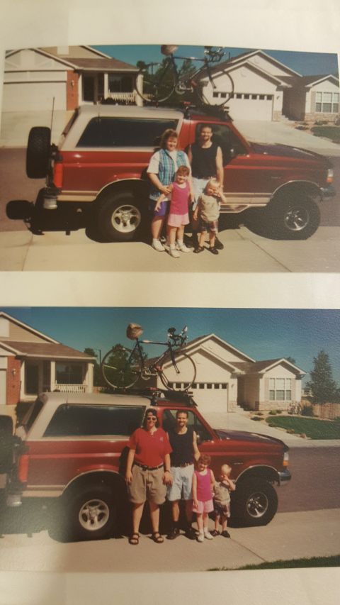 1996 Ford Bronco - Family poses with their red and tan 1996 Ford Bronco, complete with bicycles mounted on the roof rack.