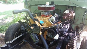 1978 Ford Bronco - Close-up of a vehicle's engine compartment, showing the engine and related components.