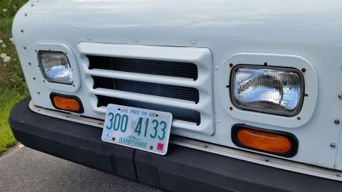 1991 Ford LTD Crown Victoria - Front view of a white truck, its grille and headlights. A New Hampshire license plate is visible.