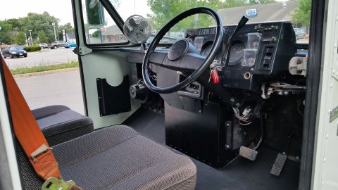 1991 Ford LTD Crown Victoria - Interior of a truck cab with seats, steering wheel, and dashboard visible.