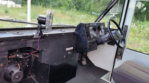 1991 Ford LTD Crown Victoria - Interior view of a vehicle's dashboard, showing the steering wheel, gauges, and a fan.