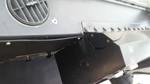 1991 Ford LTD Crown Victoria - Interior view of a car's dashboard, focusing on an air vent and surrounding trim panels.