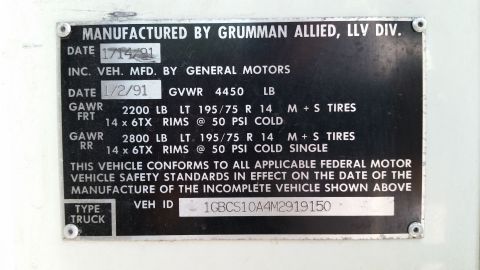 1991 Ford LTD Crown Victoria - Vehicle data/spec plate from Grumman Allied LLV (on GM chassis) showing build date, GVWR 4450 lb, GAWR ratings, tire sizes and VEH ID 1GBCS…