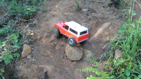 1989 Ford Bronco - A remote control vehicle navigates a rocky, outdoor terrain.