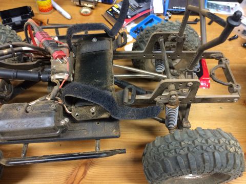 1989 Ford Bronco - The chassis of a remote control car is shown with its internal components and suspension system.