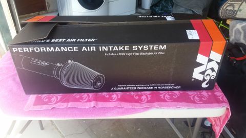 1992 Ford Bronco - A K&N Performance Air Intake System is shown in its packaging, promising increased horsepower.