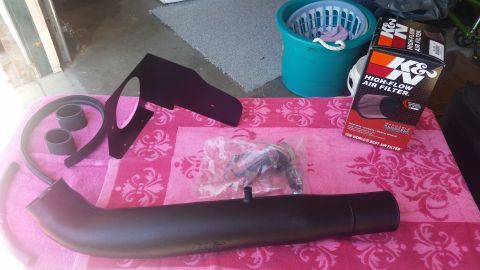 1992 Ford Bronco - K&N air intake system components and filter are ready for installation.