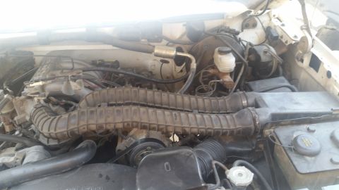 1992 Ford Bronco - The engine bay shows a K&N air intake system installed on a vehicle.