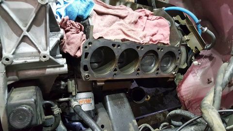 1996 Ford Bronco - Engine block with cylinders visible, undergoing some form of maintenance or repair.