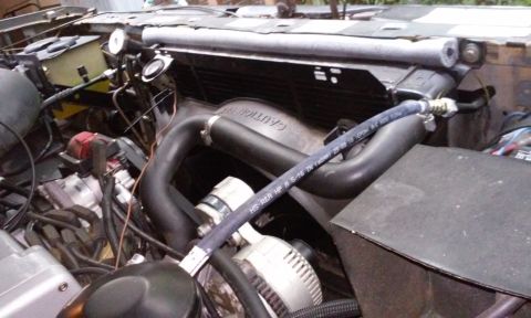 1986 Ford Bronco - Top of shroud does not cover top 3" of radiator.