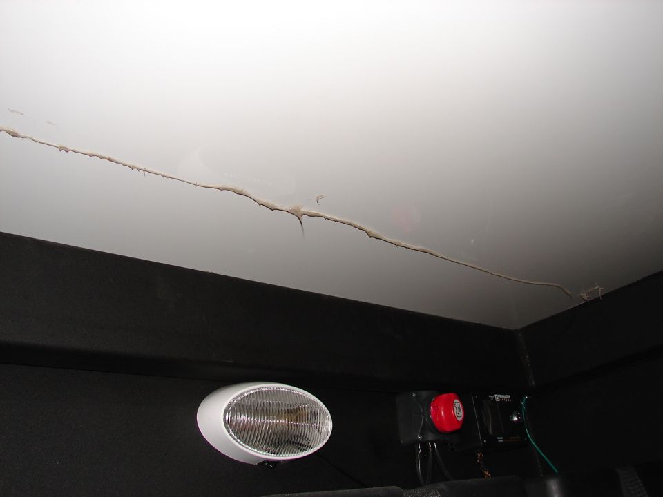 Silicone adhesive  was not put in the correct place to hit the cross member in several places as can be seen by the next few pictures
