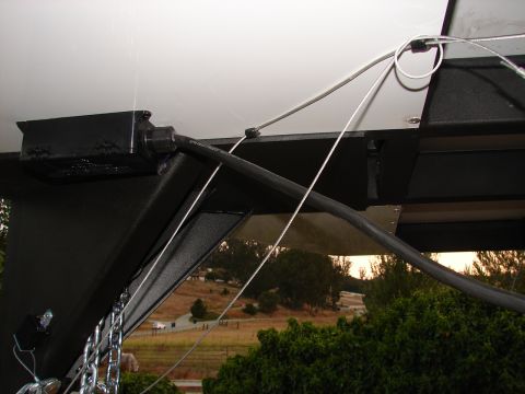 1973 Ford Ranchero - Close-up view of a trailer hitch mechanism, showing chains and wiring.