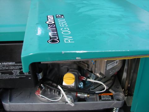 1973 Ford Ranchero - Close-up of the engine compartment of a Cummins Onan RV QG 5500 LP generator.
