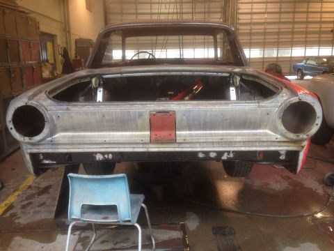 1964 Ford Fairlane - This 1964 Ford Fairlane is undergoing preparation for a new paint job in a workshop setting.