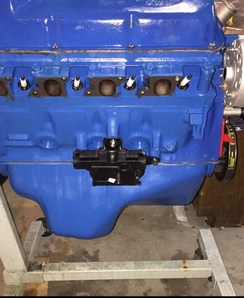 1978 Ford Bronco - A blue Ford V8 engine is shown, likely a part from a larger vehicle.