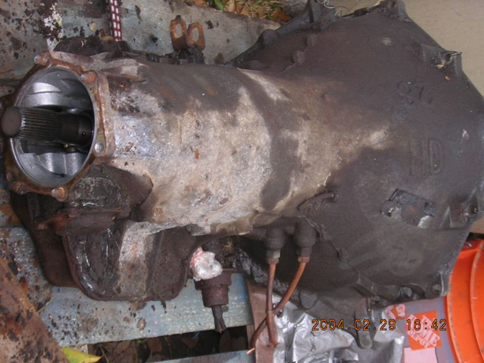 Transmission part with splined shaft visible and "HD" casting mark