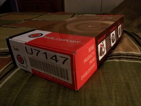 2007 Ford Crown Victoria - A DiabloSport U7147 power programmer box is shown on a bed. The box has red and white branding with text including "DIABLOSPORT" and "THE P…