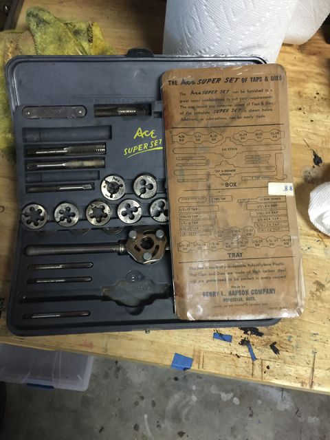 1978 Ford Bronco - A vintage Ace Super Set of Taps & Dies tool kit is laid out on a wooden surface. The kit includes a gray plastic case with various taps and…