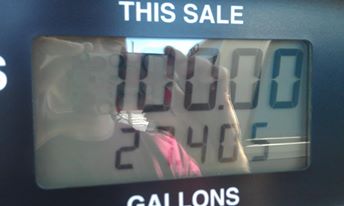 1996 Ford Bronco - A digital display on a gas pump shows "THIS SALE" at the top, with the sale amount reading "100.00" and the gallons reading "27.405".