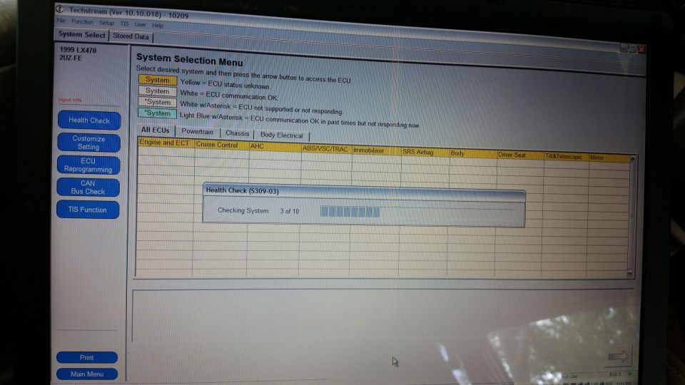 Computer screen showing Techstream software with a health check in progress for a 1999 Lexus LX470.
