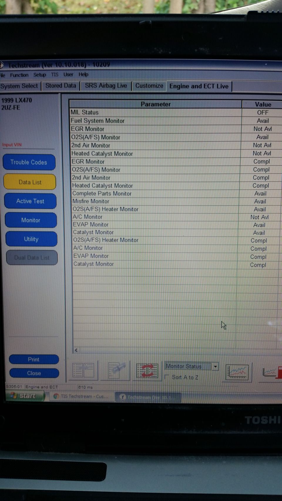 Laptop screen showing vehicle diagnostic data for a 1999 Lexus LX 470.
