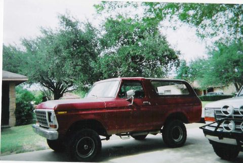 1978 Ford Bronco - This 1978 Ford Bronco is seen parked outdoors, showing its side profile and front grille.