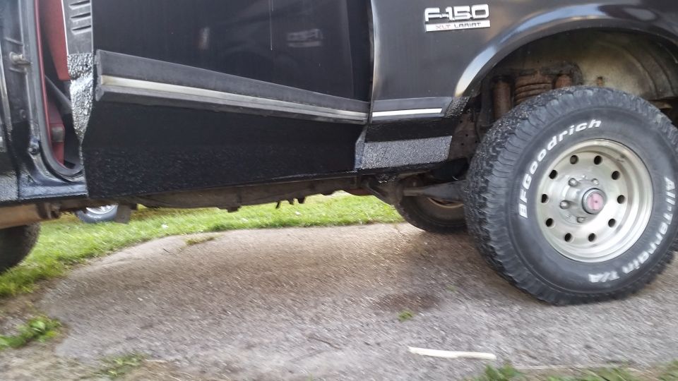 Black Ford F-150 driver's side rocker panel and BFGoodrich All-Terrain tire.