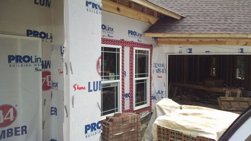 But the front door, dining room, & garage brick hasn't been started yet.  The front porch will be stone with a front arch & side slits.