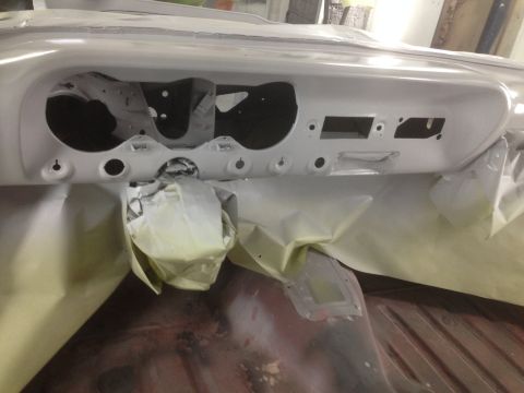 1964 Ford Fairlane - The interior of a car is shown with the dashboard area masked off and ready for a new coat of paint.