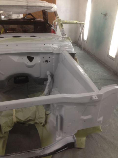 1964 Ford Fairlane - The front end of a 1964 Ford Fairlane is prepared for painting inside a booth.