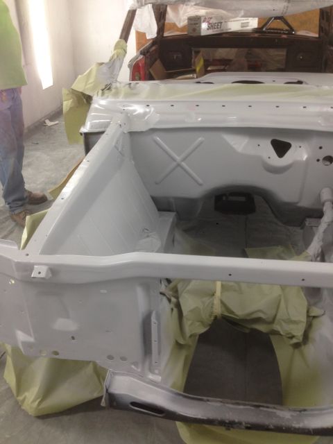 1964 Ford Fairlane - Car body in paint prep, showing the engine bay and front end masked off.