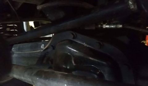 1979 Ford Bronco - Close-up view of the undercarriage, focusing on the suspension and differential assembly.