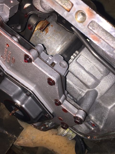 1989 Ford Bronco - this is a shot of the inside of the C6 transmission in my bronco after i first dropped the pan. this shot is from laying under the vehicle,…