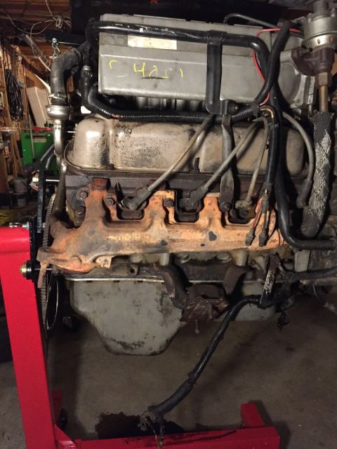 1989 Ford Bronco - passenger side of the motor as i got it. note that there does appear to be some paint on the block, it is most noticable on the freeze plug…