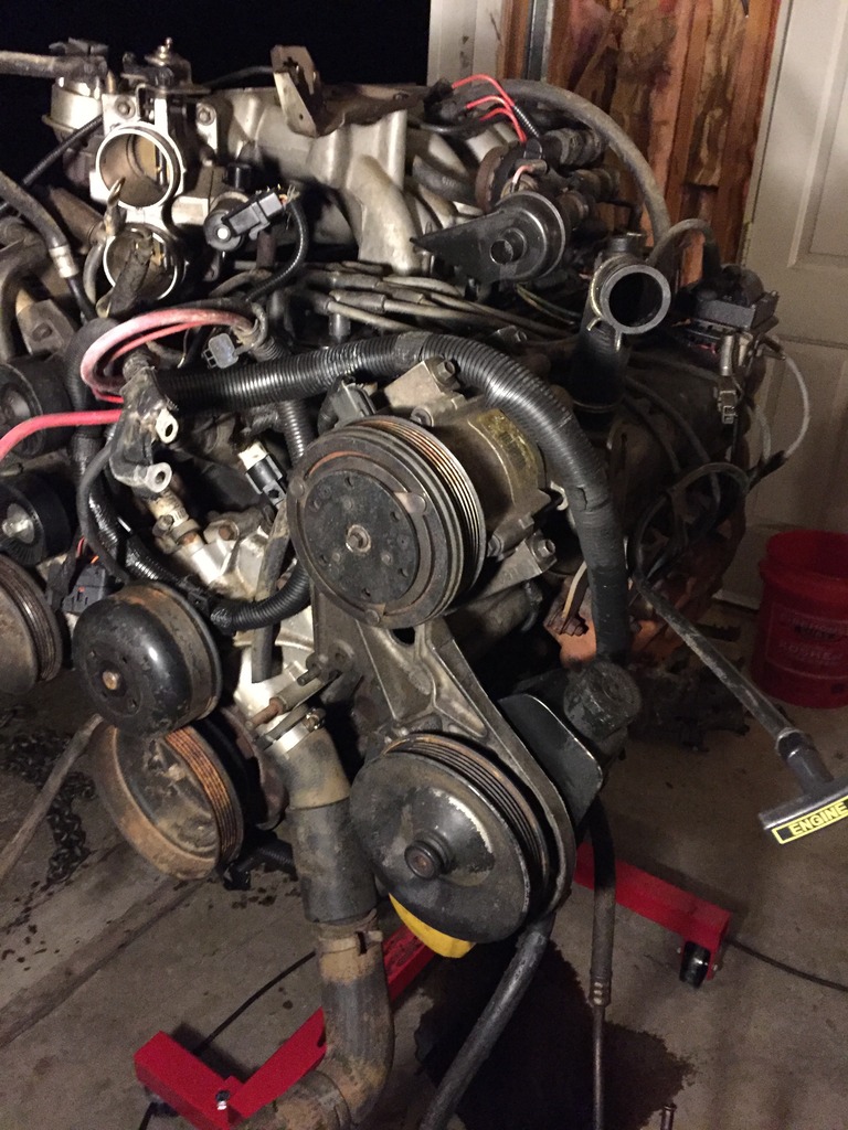 here's the front of the motor.  since the motor was from an e-van, it has a saginaw power steering pump! score!