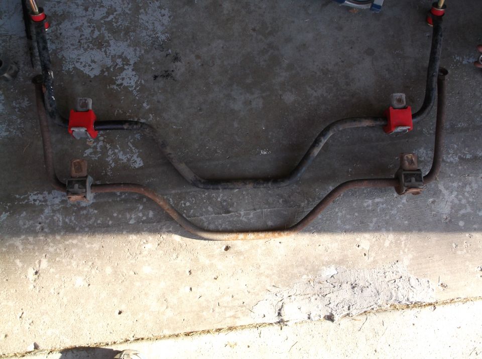 Two sway bars with red bushings