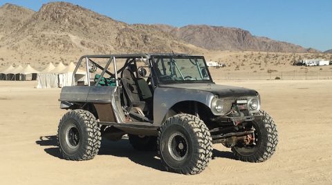 1961 International Scout 800 - A heavily modified 1961 International Scout 800 sits in a desert environment, ready for off-road adventures.