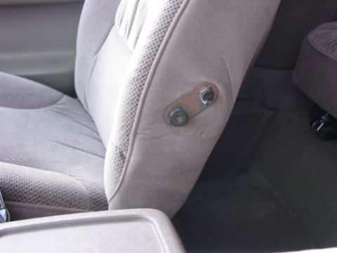 1992 Ford Bronco - The photo shows the mounting hardware for a vehicle seat, not the exterior of a 1992 Ford Bronco.
