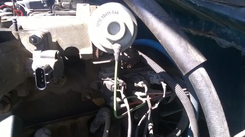 1996 Ford F-150 - A close-up view of an engine component, possibly from a Ford truck, with a visible part number.
