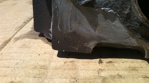 1996 Ford F-150 - A metal casting with a date stamp of '95' is shown, possibly indicating its manufacturing year.