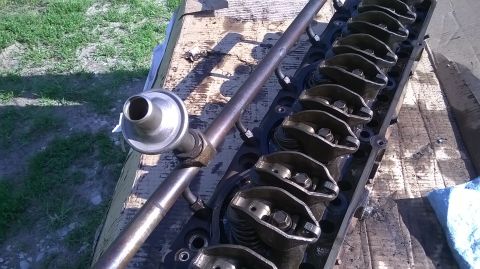 1996 Ford F-150 - Close-up of an engine cylinder head, showing rocker arms and a fuel rail component.
