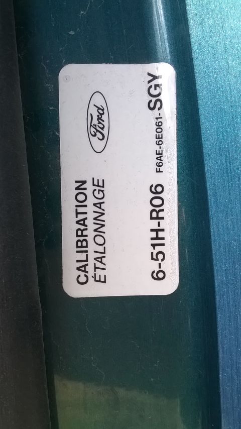 1996 Ford F-150 - A close-up of a Ford calibration sticker with part number 6-51H-R06 SGY.