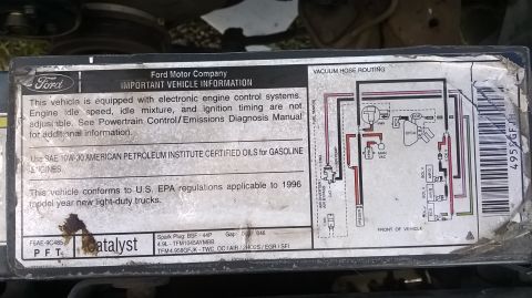 1996 Ford F-150 - This sticker provides important vehicle information and a vacuum hose routing diagram.